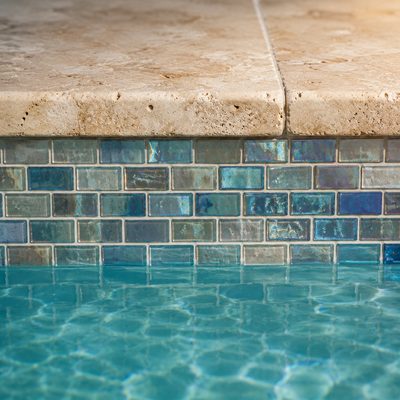 Glass mosaic pool waterline